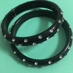 Set of 2 plastic bangle bracelets—all